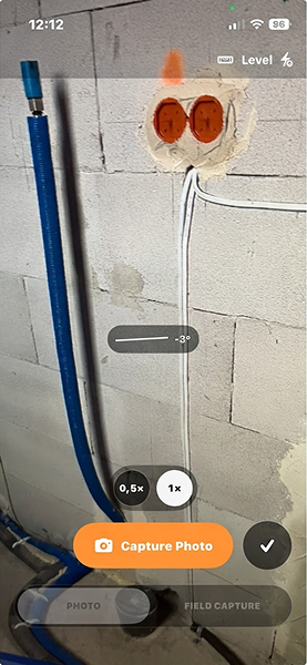 ProofLog captured-photo confirmation with checkmark and cancel controls.